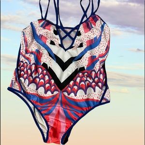 Slinky feel multi color one piece.  Will fit a size 8/10.